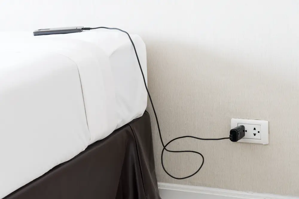 Can You Plug Something in Behind Your Bed?